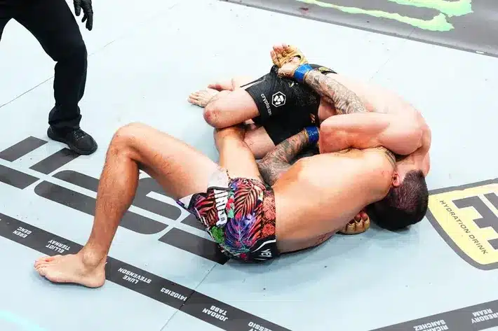 Islam Makhachev Cinches D'arce Choke To Submit Dustin Poirier At UFC 302