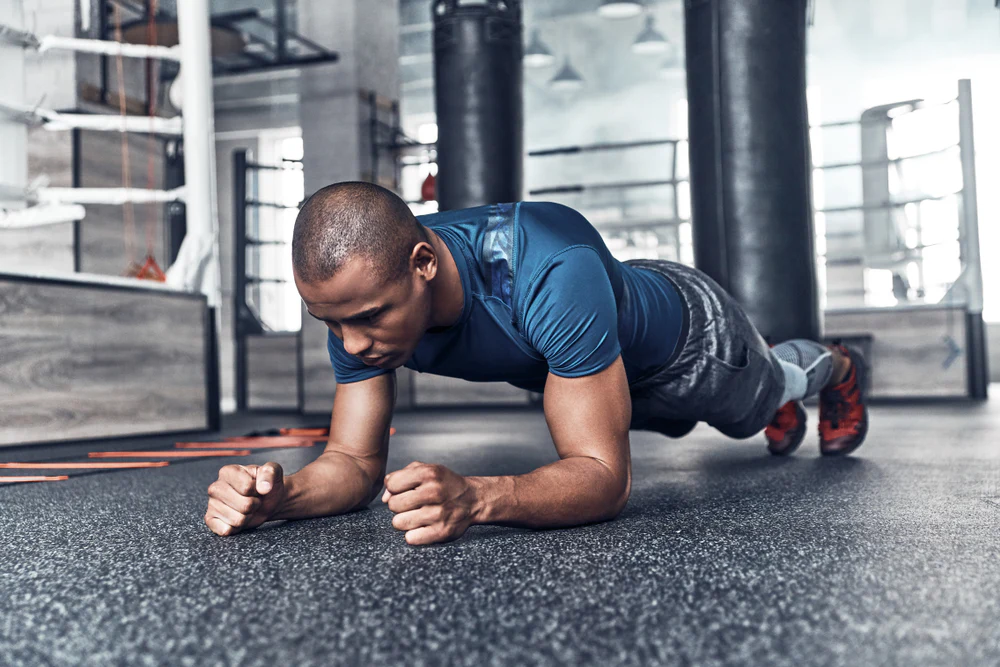 fit athlete doing a plank