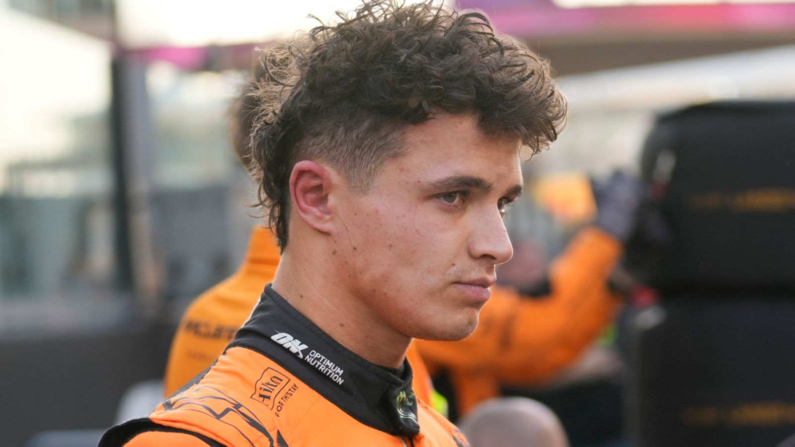 McLaren driver Lando Norris of Britain stands in the pit lane before the Formula One Abu Dhabi Grand Prix at the Yas Marina Circuit in Abu Dhabi, UAE, Sunday, Dec. 8, 2024. (AP Photo/Darko Bandic)