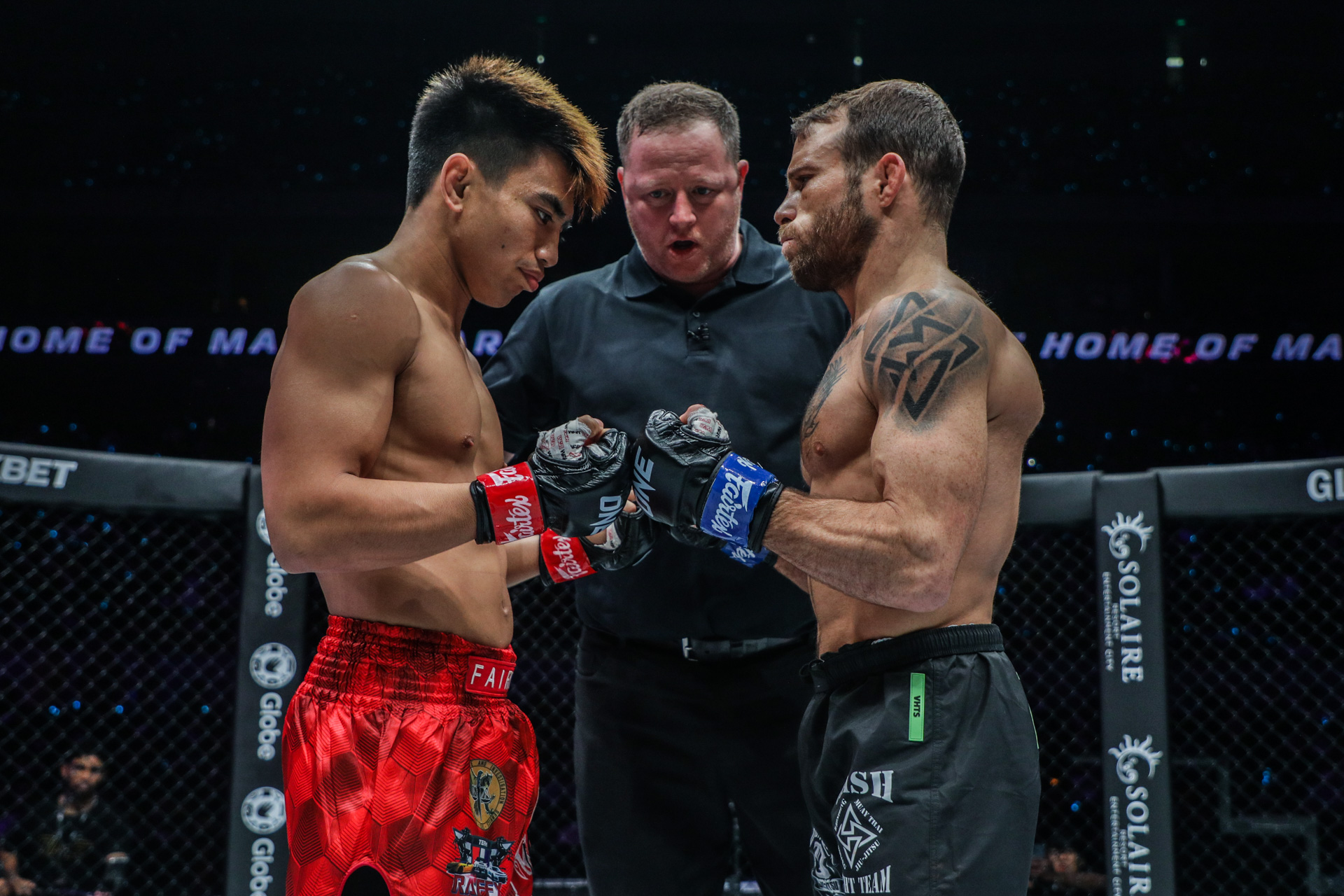 Jarred Brooks touches gloves with Joshua Pacio at ONE 164
