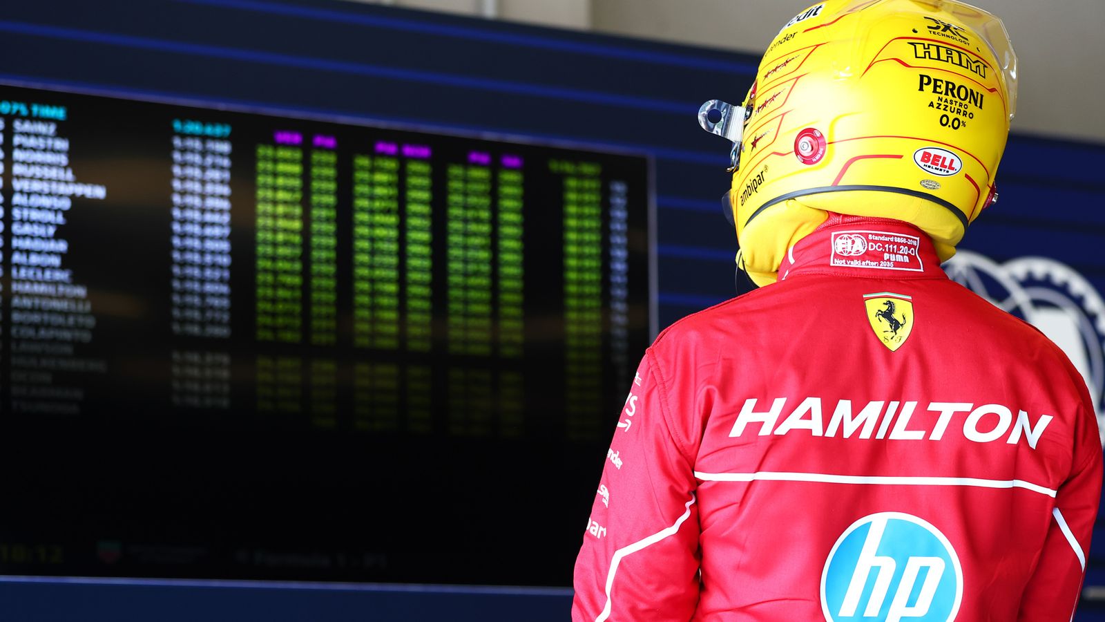 Lewis Hamilton looks at the timing screens after being knocked out of Q2