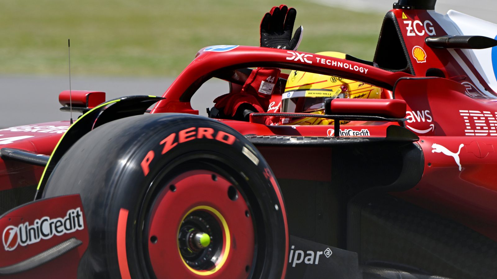 Lewis Hamilton waves from the Ferrari cockpit to the Montreal crowd during the Canadian GP weekend