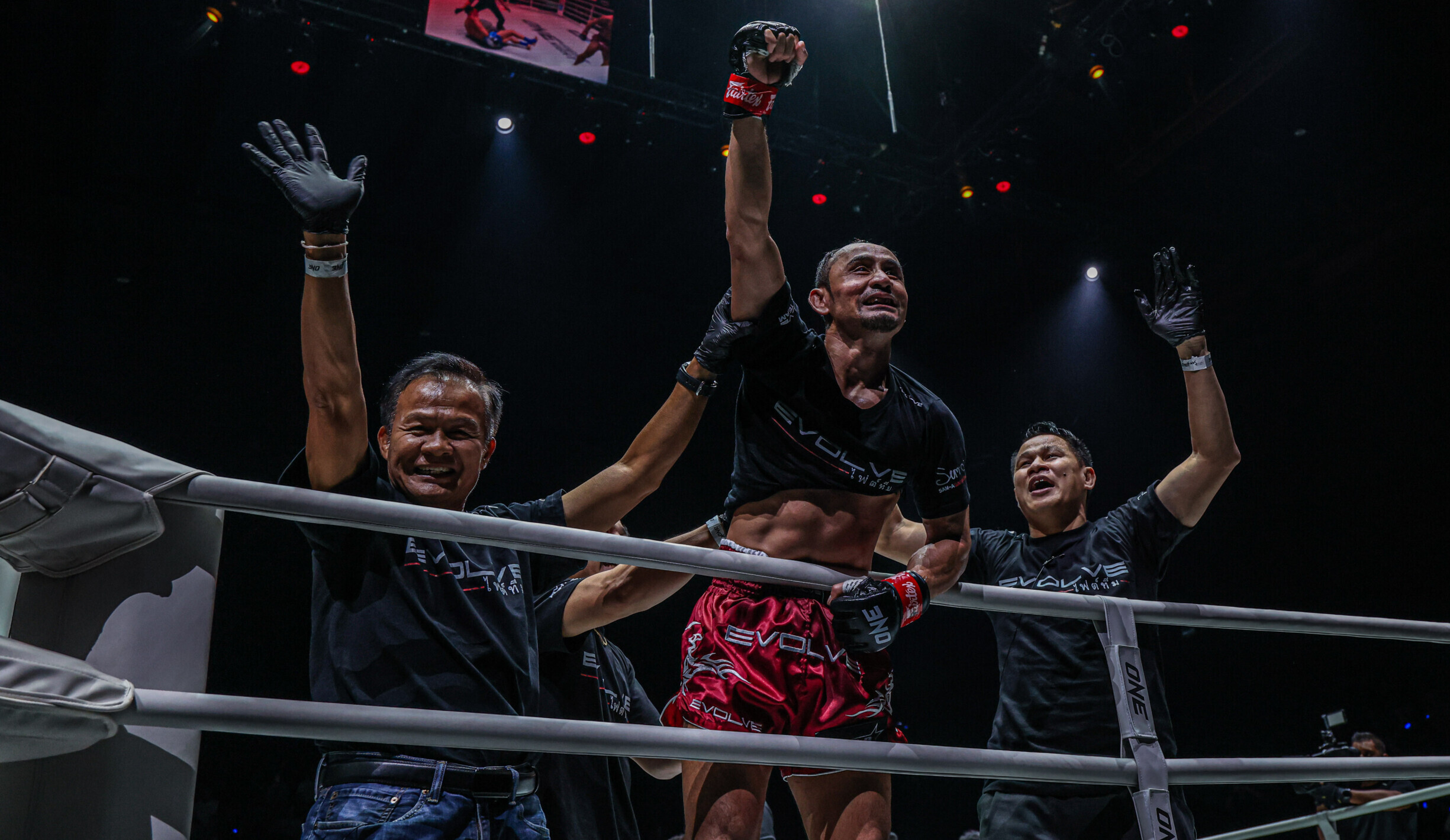 Sam A Gaiyanghadao celebrates his victory in the ring with his team