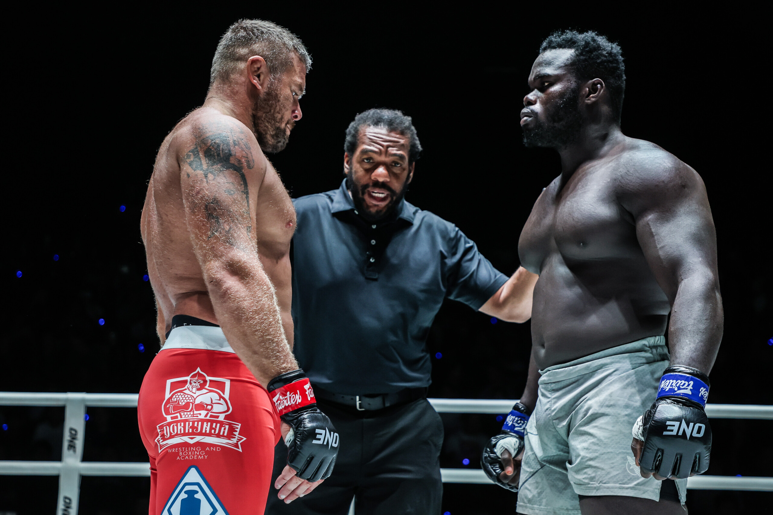 Anatoly Malykhin and "Reug Reug" Oumar Kane listen to Herb Dean before their MMA World Title fight