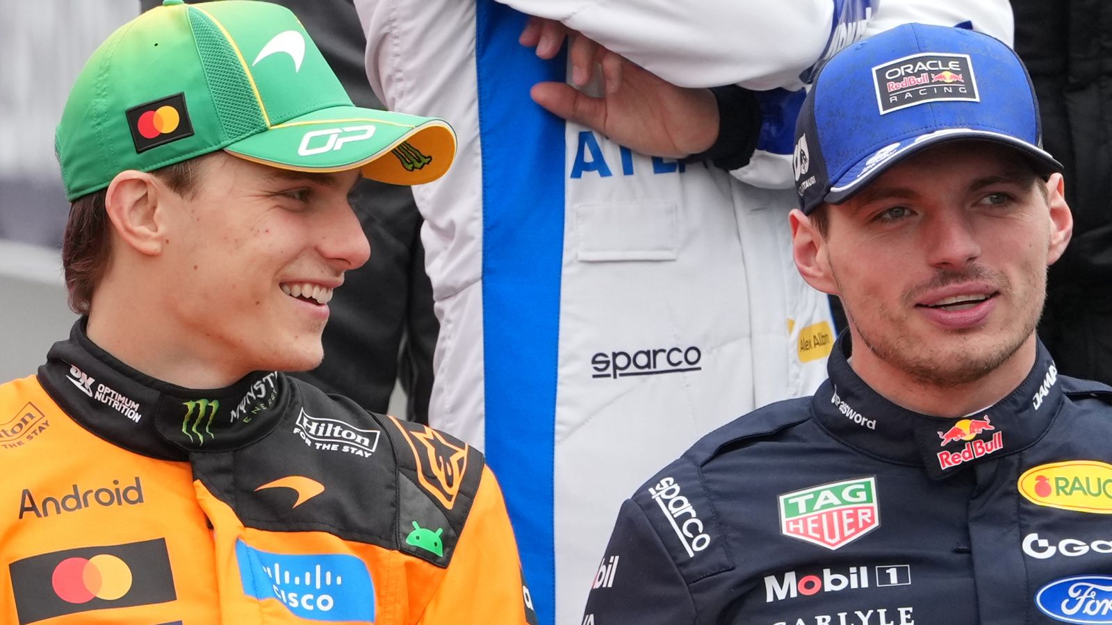 Red Bull driver Max Verstappen, right, of the Netherlands and McLaren driver Oscar Piastri of Australia chat during the drivers photo ahead of the Australian Formula One Grand Prix at Albert Park, in Melbourne, Australia, Sunday, March 8, 2026. (AP Photo/Asanka Brendon Ratnayake)
