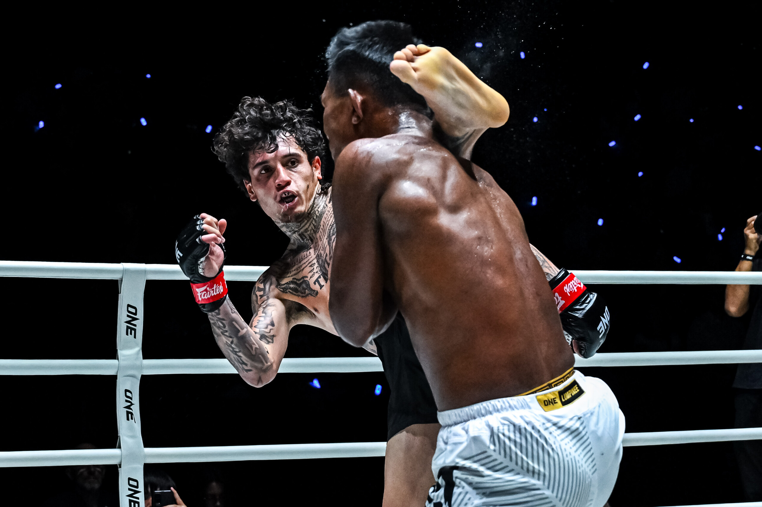 Titus Proctor lands a high kick on Tun Min Aung at The Inner Circle 18