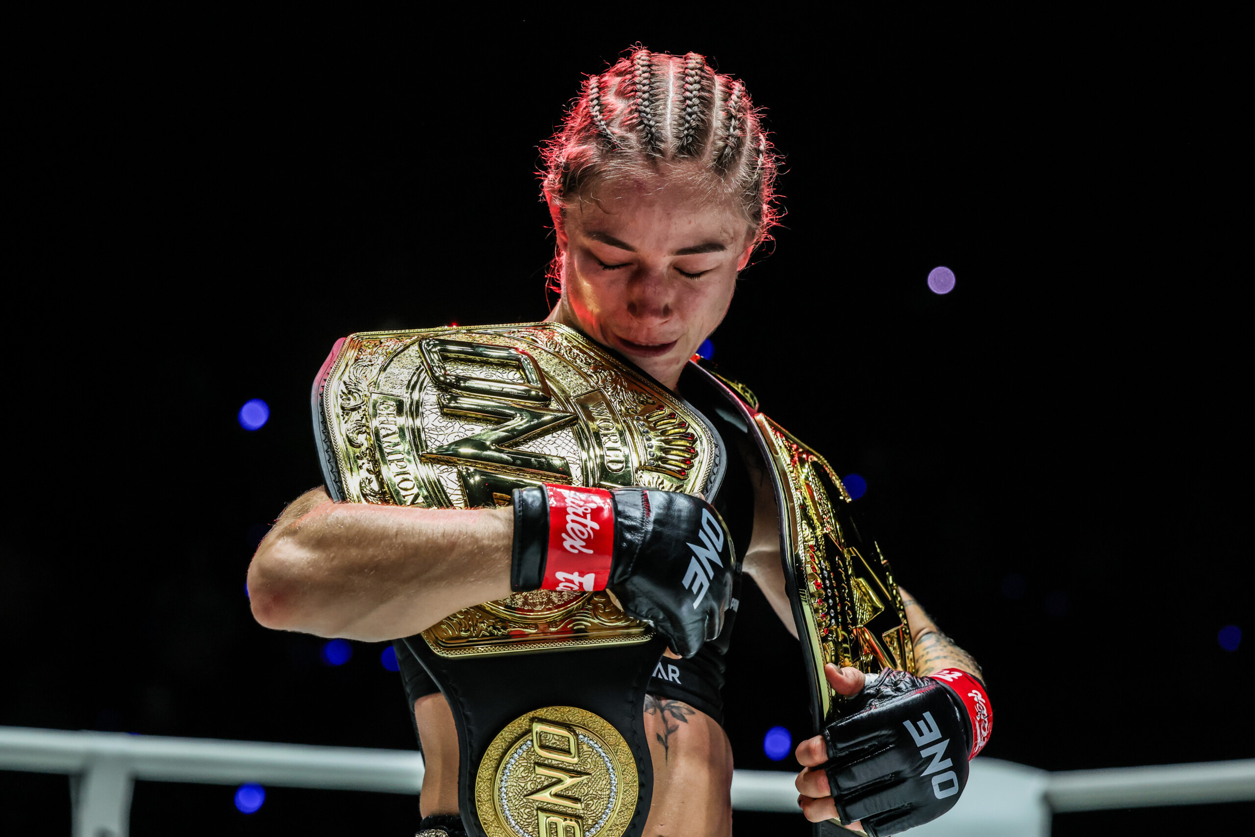 Stella Hemetsberger with her two belts after beating Natalia Diachkova at ONE Fight Night 46